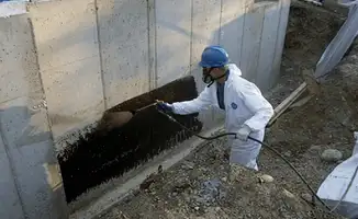 Professional waterproofing the exterior walls of the basement in Baltimore, MD