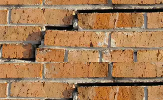 Brick wall with serious structural damage in Baltimore, MD